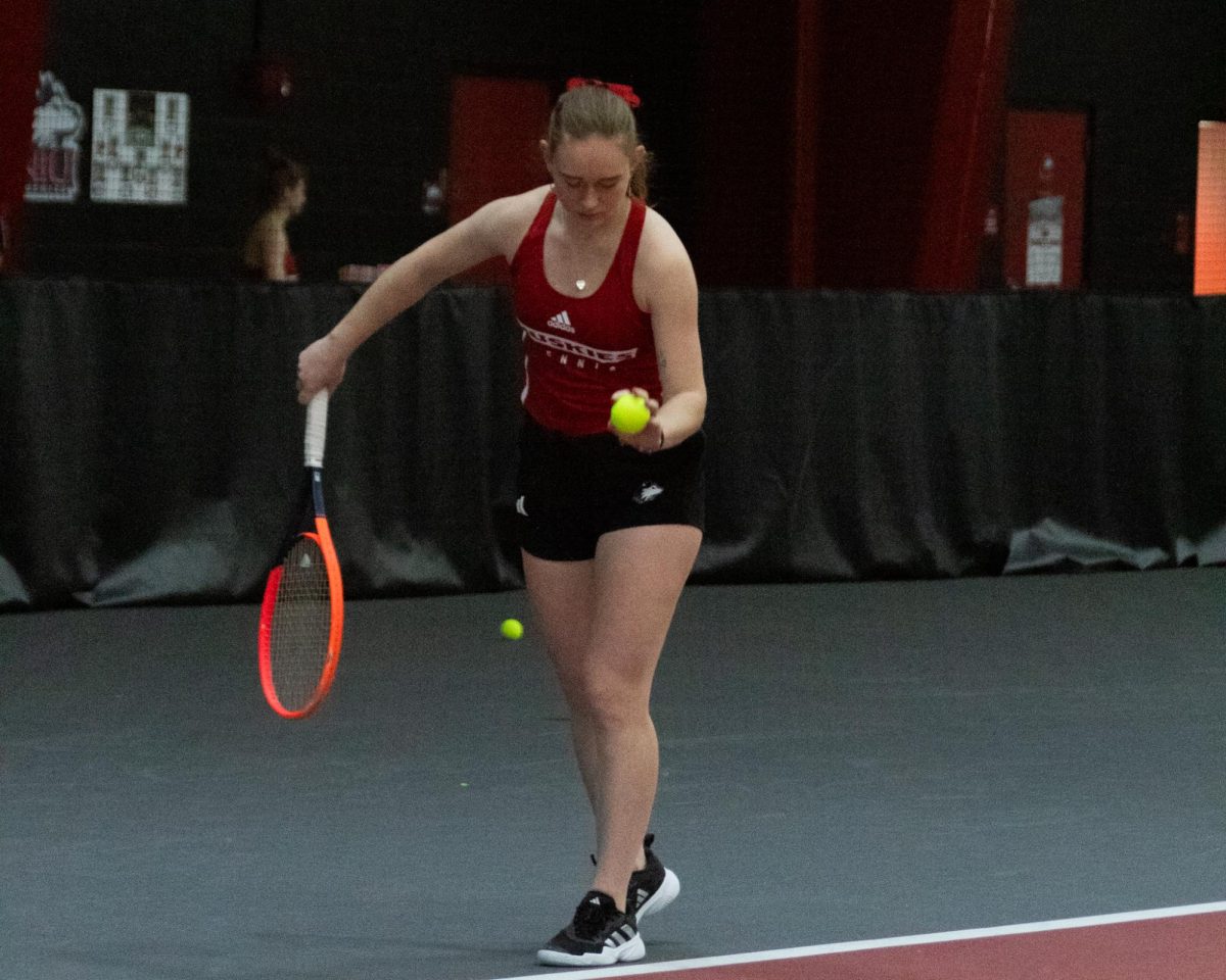NIU+senior+Diana+Lukyanova+bounces+the+ball+before+serving+at+the+Nelson+Tennis+Center+at+Chick+Evans+Field+House+Saturday.+Lukyanova+won+all+her+matches+in+both+singles+and+doubles+as+womens+tennis+defeated+Eastern+Illinois+University+7-0+and+University+of+St.+Thomas+6-1.+%28Katherine+Follmer+%7C+Northern+Star%29