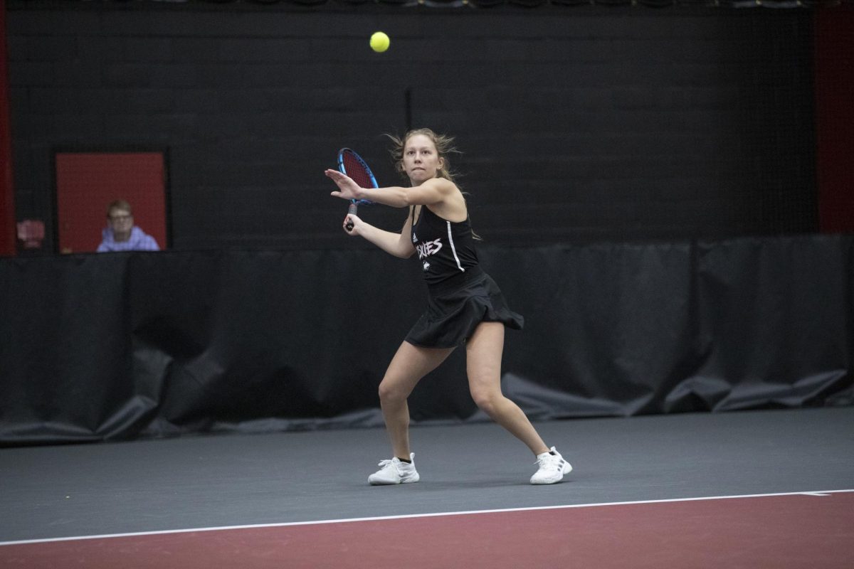 Sophomore+Jenna+Horne+winds+up+a+shot+at+the+Nelson+Tennis+Center+at+Chick+Evans+Field+House.+Horne+won+her+doubles+match+with+junior+Reagan+Welch+6-4+as+NIU+defeated+Lewis+University+5-2.+%28Courtesy+of+NIU+Athletics%29