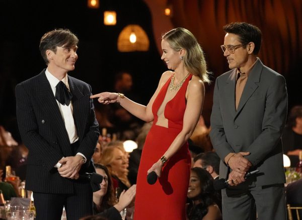 Cillian Murphy (from left), Emily Blunt and Robert Downey Jr. stand on a stage holding microphones. Oppenheimer has 13 nominations and could make a sweep at the Oscars. (AP Photo/Chris Pizzello)