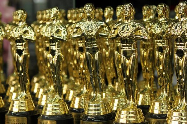 Many gold trophies sit in a line. The 96th Academy Awards will occur Sunday, and the Northern Star is hosting a contest to see who can predict the winner of six of the biggest categories. (Prayitno | CCA2.0)