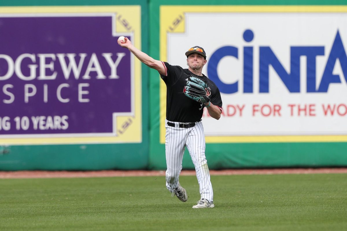 Senior outfielder/infielder Parker Shupe throws from the outfield in an NIU baseball game against Louisiana State University. NIU baseball started the 2024 season 7-14, but already look to surpass the total win count of the 2023 season. (Courtesy of Jonathan Mailhes)