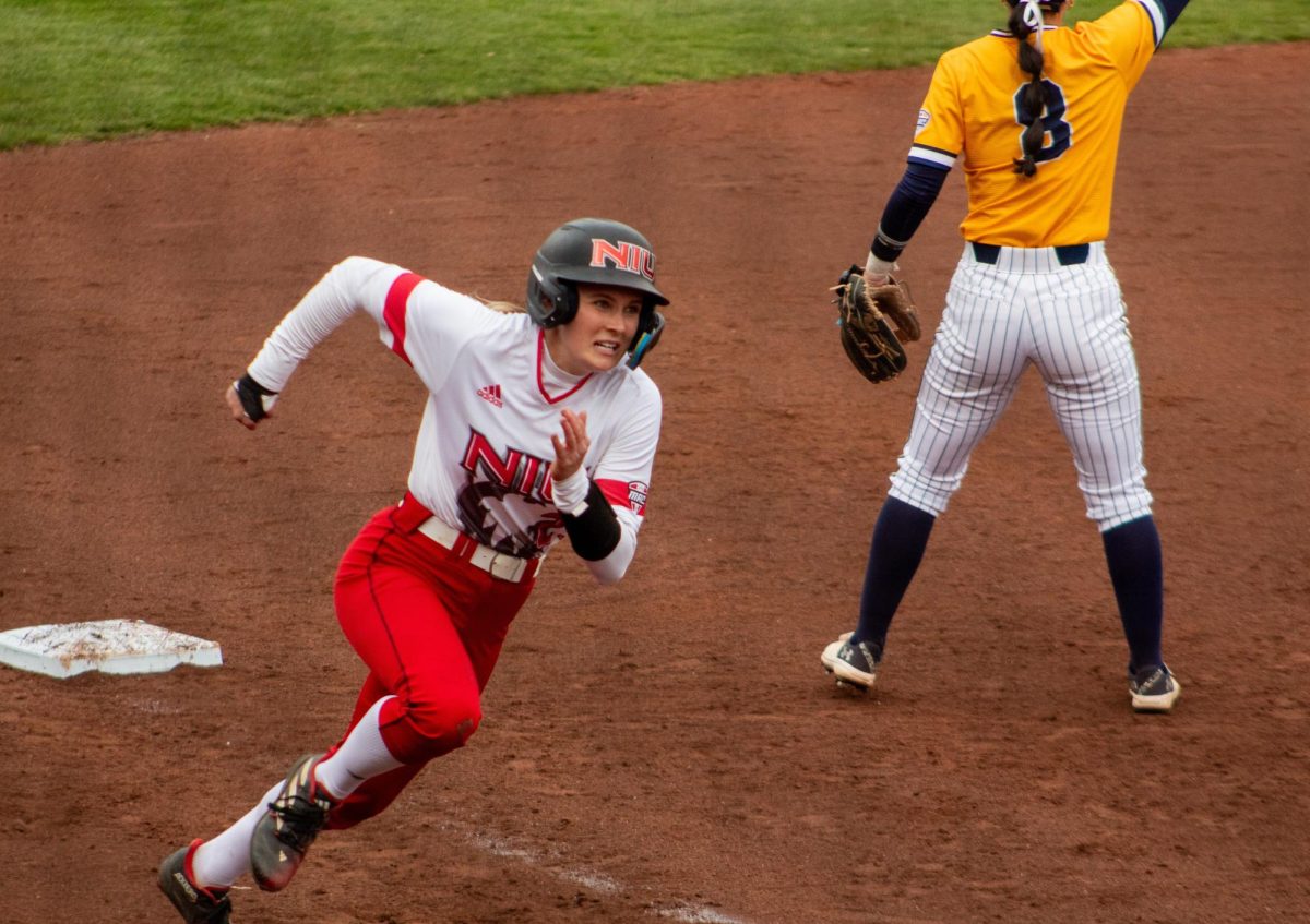 Senior+catcher%2Foutfielder+Ellis+Erickson+rounds+third+base+in+an+NIU+softball+home+game+against+Kent+State+University+on+Friday.+Erickson+scored+the+game-winning+run+to+seal+the+Huskies+3-2+walk-off+victory+over+the+Golden+Flashes.+%28Totus+Tuus+Keely+%7C+Northern+Star%29