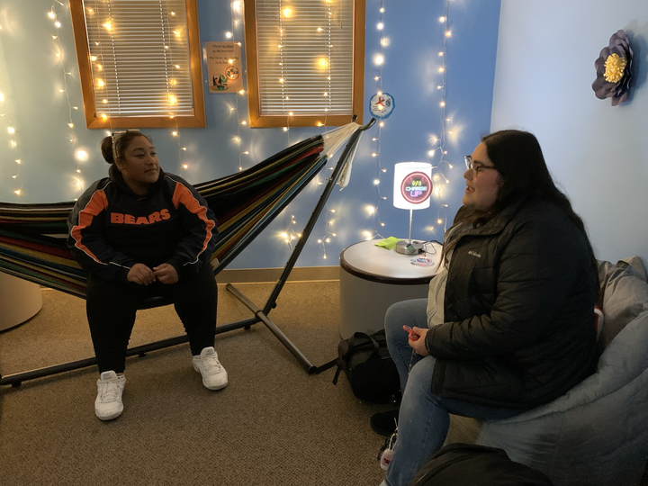 Bianca Galicia (left), a senior non-profit and NGO studies major chats with friend, Itzel Sanchez, senior and NGO studies major in the Latino Resource Center Wellness Lounge. The LRC held the opening of its Wellness Lounge at 4:30 p.m. on Tuesday. (Rachel Cormier | Northern Star)