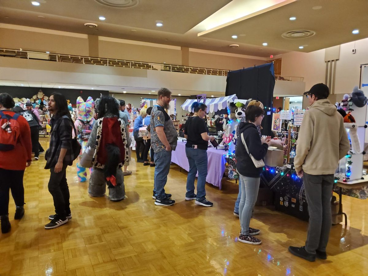 A+group+of+people+stand%2C+looking+at+booths+at+Karoshi-Con.+Karoshi-Con+is+the+NIU+Anime+Associations+annual+convention+and+was+held+on+Saturday.+%28Jonathan+Shelby+%7C+Northern+Star%29