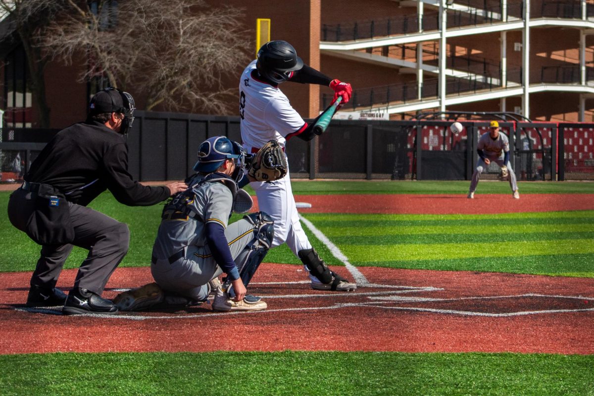 Senior catcher Colin Summerhill (8) hits a ground ball to Kent State senior shortstop Kyle Jackson (4) who throws him out in the fourth inning. Summerhill would later score NIU’s first run by hitting a home run to left field earning him the single-season home run record. (Totus Tuus Keely | Northern Star)
