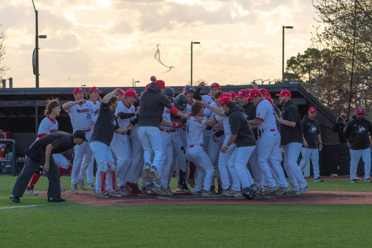 The+Huskies+baseball+team+celebrate+after+freshman+catcher+Cooper+Cohn+%284%29+hit+a+home+run+to+win+the+game+against+Valparaiso+on+Tuesday.+NIU+was+tied+9-9+after+the+top+of+the+ninth+inning+until+Cooper+hit+the+home+run+with+only+one+out+in+the+inning.+%28Totus+Tuus+Keely+%7C+Northern+Star%29%0A