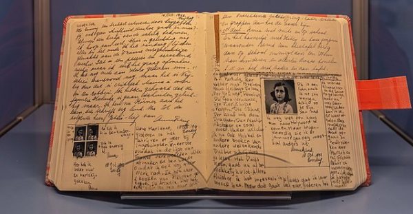 Anne Frank’s diary rests open on display. Works such as Anne Frank’s “The Diary of a Young Girl” and Elie Wiesel’s “Night” should be taught in schools to emphasize their historical importance, not their literary merit. (Courtesy of Wikimedia Commons)
