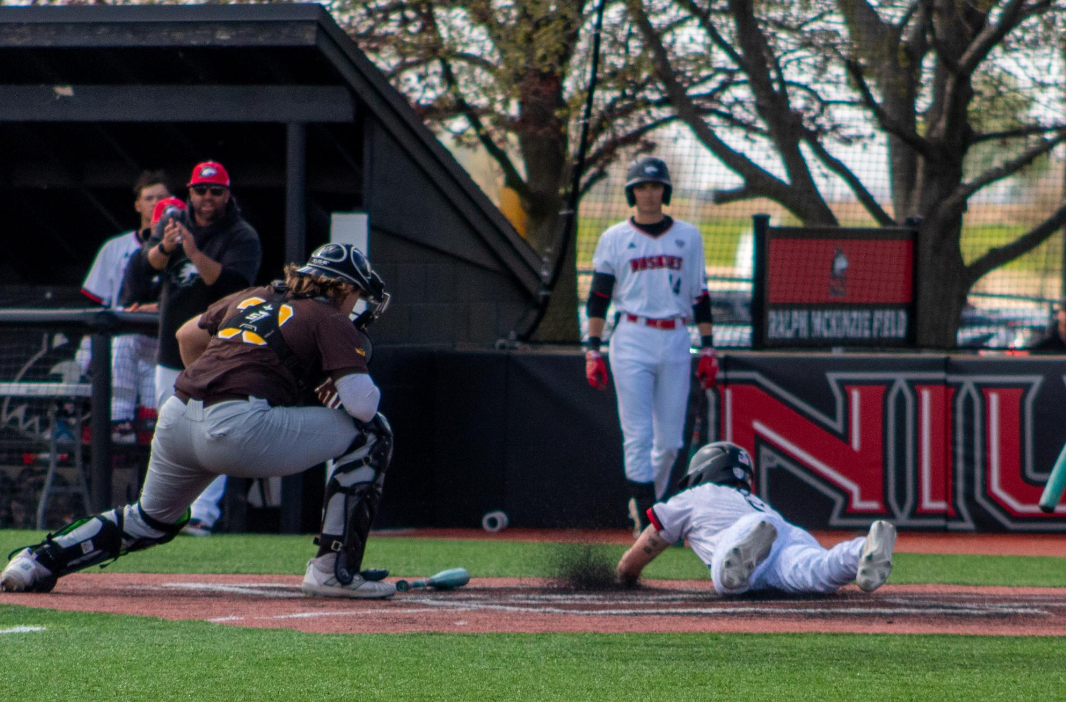Senior infielder Eric Erato slides into home plate on April 23 at Ralph McKinzie Field at Walt and Janice Owens Park. Erato drove in two runs in Saturdays 9-6 win over Central Michigan University. (Northern Star File Photo)