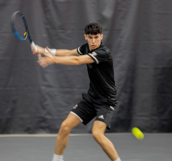Sophomore Iker Gaztambide Arrastia winds up for a strike on March 2 at the Nelson Tennis Center at Chick Evans Field House. NIU mens tennis lost 4-3 to Western Michigan University on Sunday to drop to the No. 2 seed in the MAC Championship. (Northern Star File Photo)