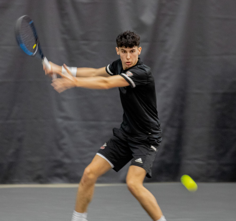 Sophomore+Iker+Gaztambide+Arrastia+winds+up+for+a+strike+on+March+2+at+the+Nelson+Tennis+Center+at+Chick+Evans+Field+House.+NIU+mens+tennis+lost+4-3+to+Western+Michigan+University+on+Sunday+to+drop+to+the+No.+2+seed+in+the+MAC+Championship.+%28Northern+Star+File+Photo%29