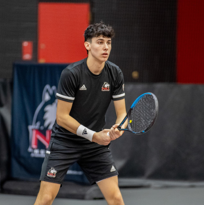 NIU sophomore Iker Gaztambide Arrastia gets set for an opponents serve during a doubles match on March 2. Gaztambide Arrastia was the only Huskie to win a match as NIU mens tennis lost 6-1 to the University of Toledo Sunday. (Northern Star File Photo)