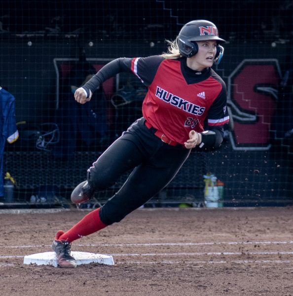 Senior catcher/outfielder Ellis Erickson (23) rounds first base after hitting a single on March 30 against Kent State University. Erickson was named to the Northern Star Sports Staffs MAC softball All-Star squad. (Northern Star File Photo)