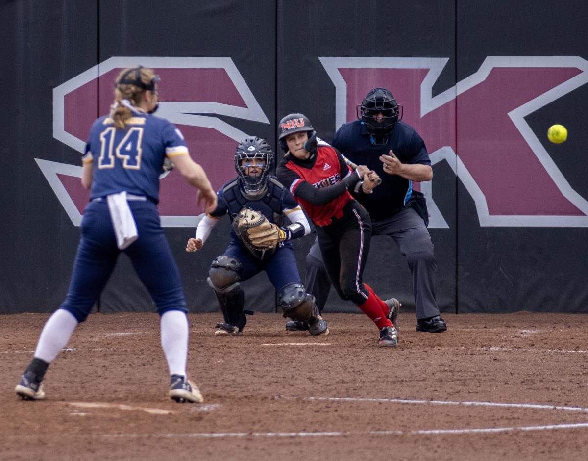 Junior+shortstop+Avery+Carnahan+%2823%29+hits+the+ball+toward+left+field+after+reaching+first+base+on+a+fielder%E2%80%99s+choice+during+the+third+inning.+Carnahan+had+three+hits+and+three+runs+batted+in+across+both+games+on+Saturday.+%28Tim+Dodge+%7C+Northern+Star%29