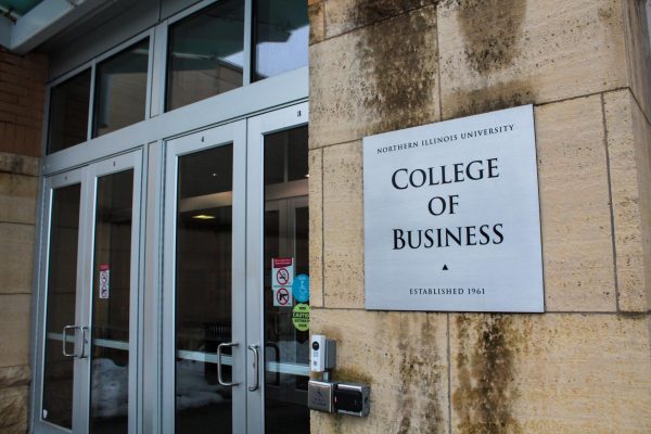 Barsema Hall stands with a sign that says College of Business. At 5 p.m. on Wednesday in Barsema Hall, Pi Sigma Epsilon will host its Career Olympics event. (Totus Tuus Keely | Northern Star)