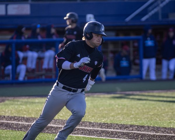 NIU freshman catcher Cooper Cohn (4) runs to first after hitting a double that drove in two runs during the first inning. Cohn was one-for-four during the game with two runs batted in. (Tim Dodge | Northern Star) 
