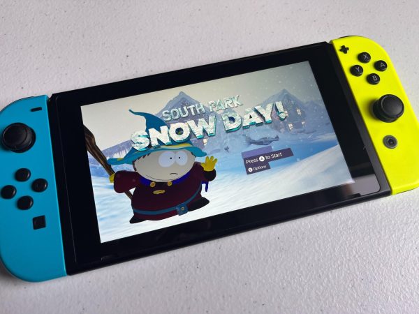 A Nintendo Switch with the title screen for South Park: Snow Day! sits on a white surface. The newest game in the South Park universe, South Park: Snow Day! changes animation and play style from previous games. (Lindsay Curtis | Northern Star)