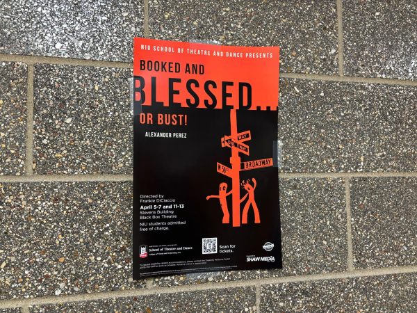 A black and red poster is displayed against a gray wall. The global premiere of Booked and Blessed...or Bust will be April 5. (Nick Glover | Northern Star)