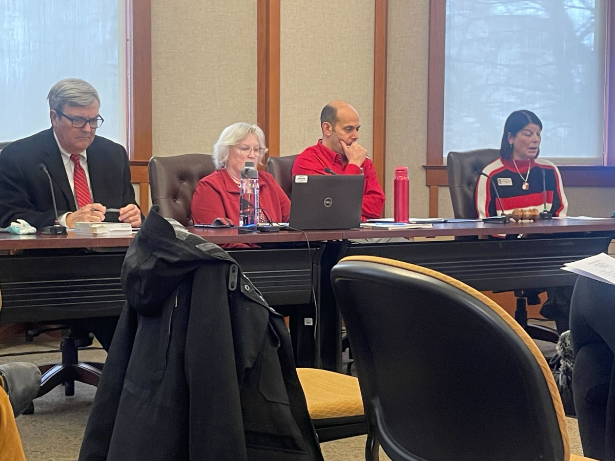 President Lisa Freeman sits at a table with members of University Council at their meeting Wednesday. NIU has taken measures to support students struggling with the financial aid process. (Emily Beebe | Northern Star)