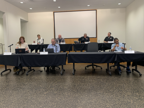The DeKalb City Council sit and share their council member reports at the City Council meeting on April 8. The board approved an agreement for the Illinois Aviation Academy to train pilots at the DeKalb Municipal Airport. (Rachel Cormier | Northern Star)