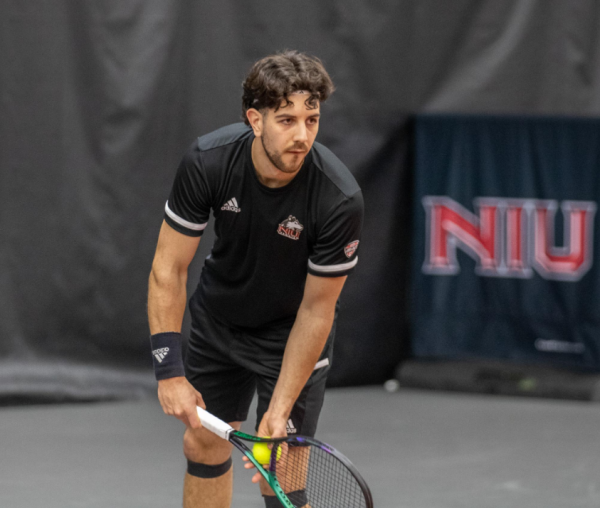 NIU senior Armin Koschtojan gets set to serve in a doubles match on March 2. Koschtojan was one of five NIU mens tennis players to win a singles match in a 5-2 win over the University at Buffalo Friday. (Northern Star File Photo)