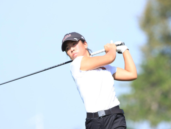 Senior Jasmine Ly follows through on her swing on Sep. 26, 2023. Ly finished tied for fifth-place at the Oral Roberts Spring Invite Tuesday as NIU womens golf took third-place. (Northern Star File Photo)
