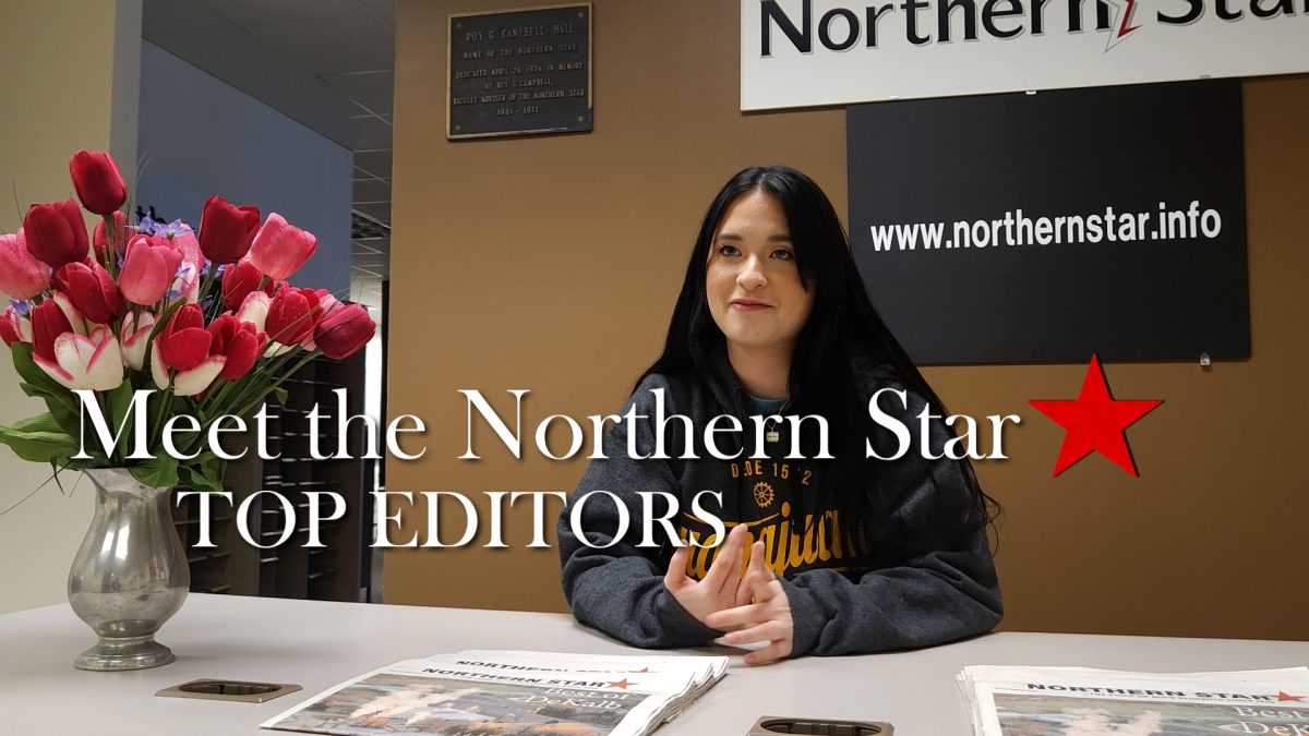 A graphic hangs over Angelina Padilla-Tompkins sitting at a desk in the Northern Star. The Northern Star Top Editors oversee all written and digital content published by the Northern Star. (Joseph Howerton | Northern Star)
