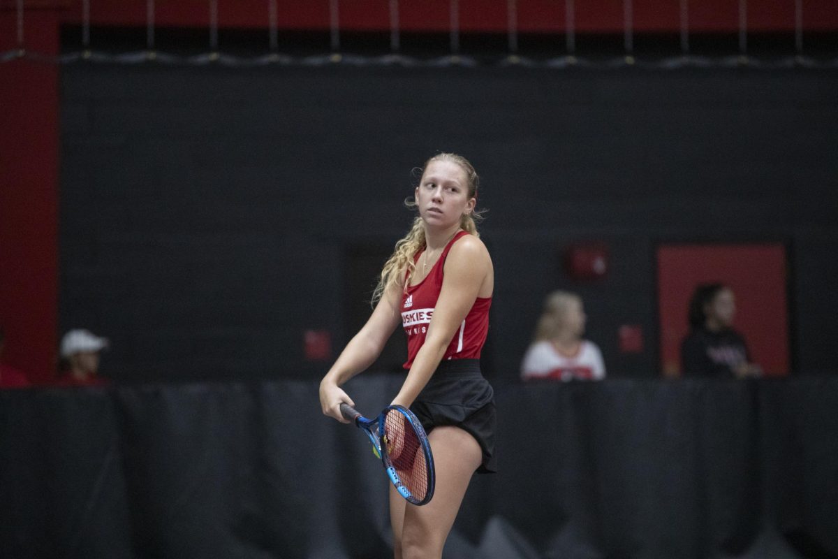 Sophomore+Jenna+Horne+prepares+to+serve+at+the+Nelson+Tennis+Center+at+Chick+Evans+Field+House.+Horne+sealed+a+4-3+victory+for+NIU+womens+tennis+on+Friday+with+a+6-2%2C+7-6+%287-4%29+win+in+the+final+match+of+the+day.+%28Courtesy+of+NIU+Athletics%29