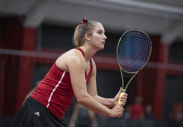 Junior Reagan Welch awaits a serve at the Nelson Tennis Center at Chick Evans Field House. Welch won her singles match and her doubles match with Anastasia Rakita in a 5-2 win over the Eastern Michigan University Eagles Friday. (Courtesy of NIU Athletics)