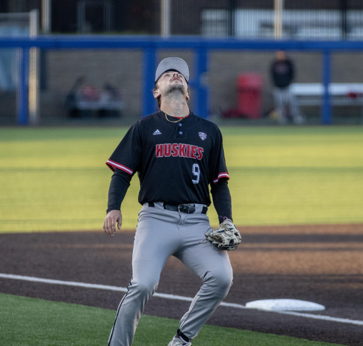 Senior infielder Jake Nelson looks for a fly ball in foul territory on April 24 at Curtis Granderson Stadium. The Huskies lost 2-0 in Sundays series finale against Central Michigan University. (Northern Star File Photo)