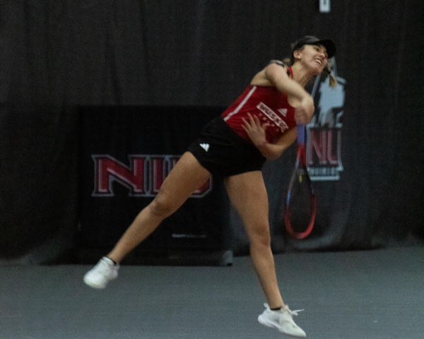 Sophomore Isabella Righi serves on March 9 at the Nelson Tennis Center at Chick Evans Field House. NIU womens tennis won its final match of the regular season 5-2 on Sunday against the University at Buffalo Bulls. (Northern Star File Photo)