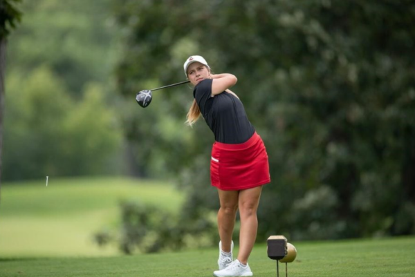 Then-junior Emily Romancew swings her driver at the Atlantic Invitational in February of 2023. Romancew finished tied for 21st at the Colonel Classic Tuesday as NIU finished 5th out of 15 teams. (Northern Star File Photo)