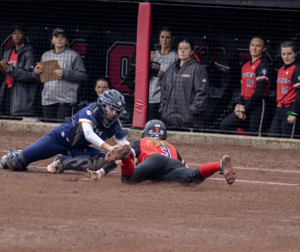 Senior infielder Caitlyn Shumaker is tagged out on a stolen base attempt on March 30 at Mary M. Bell Field. NIU softball was swept in a road doubleheader on Tuesday against Western Michigan University. (Northern Star File Photo)