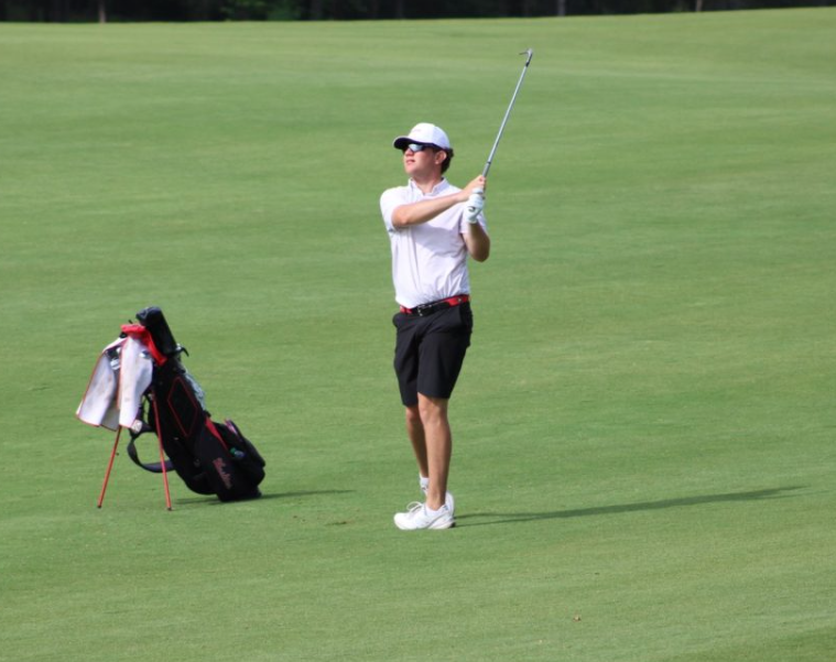 Then-sophomore+Ben+Sluzas+watches+his+shot+on+May+16%2C+2023.+NIU+mens+golf+finished+its+season+tied+for+third+place+at+the+2024+MAC+Championship.+%28Northern+Star+File+Photo%29