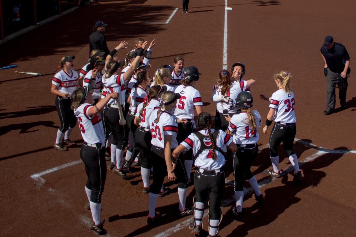 The+Huskies+celebrate+a+home+run+hit+by+sophomore+pitcher+Danielle+Stewart+%2822%29+for+the+first+at-bat+of+the+second+inning.+Stewart+has+hit+four+home+runs+this+season%2C+the+previous+home+run+was+her+first+grand+slam+of+her+career+Wednesday+at+Bradley+University.+%28Totus+Tuus+Keely+%7C+Northern+Star%29%0A