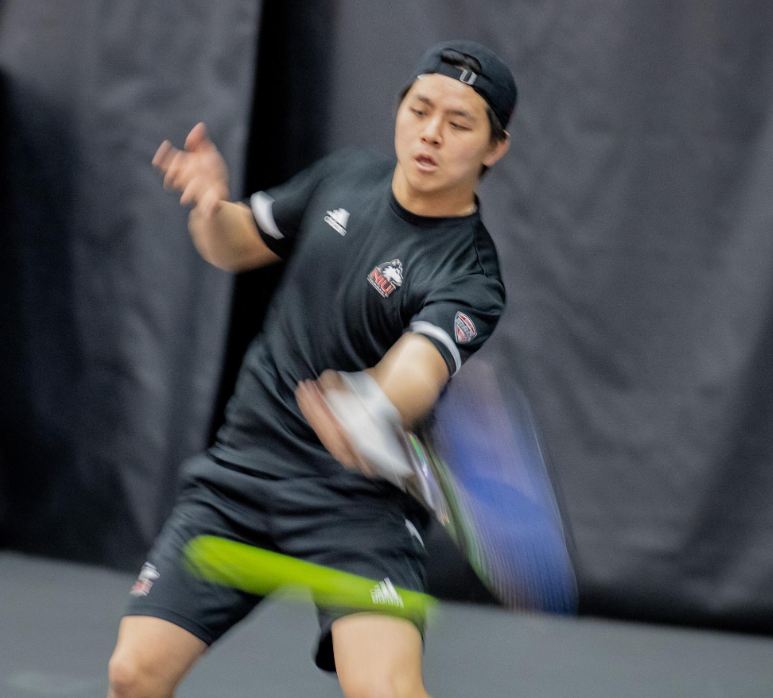 Senior Cheng En Tsai strikes the ball at the Nelson Tennis Center at Chick Evans Field House on March 2. Tsai won both his matches Friday as NIU mens tennis defeated Ball State University 5-2. (Northern Star File Photo)