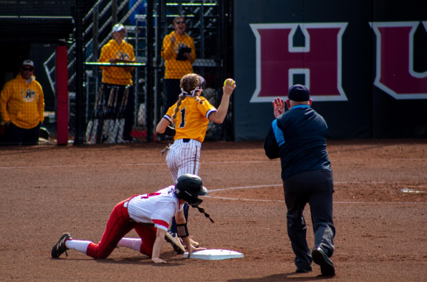 Junior middle infielder/outfielder Jenna Turner is called out on a stolen base attempt on March 29. The Huskies were swept in a three-game series against Ohio University on Saturday and Sunday. (Northern Star File Photo)