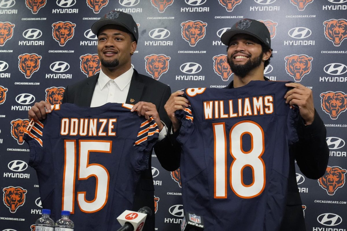 Chicago+Bears+wide+receiver+Rome+Odunze+and+quarterback+Caleb+Williams+hold+their+jerseys+at+a+press+conference+in+Lake+Forest%2C+Illinois+on+Friday.+Odunze+and+Williams+were+both+selected+in+the+2024+NFL+Draft.+%28AP+Photo%2FNam+Y.+Huh%29