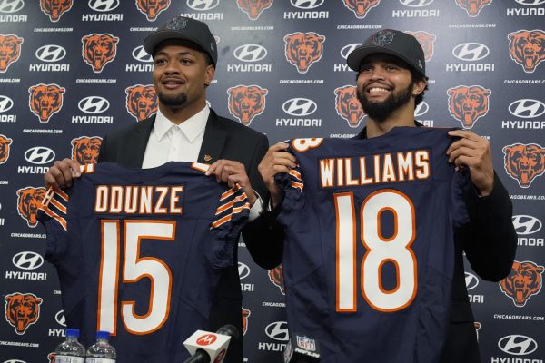 Chicago Bears wide receiver Rome Odunze and quarterback Caleb Williams hold their jerseys at a press conference in Lake Forest, Illinois on Friday. Odunze and Williams were both selected in the 2024 NFL Draft. (AP Photo/Nam Y. Huh)
