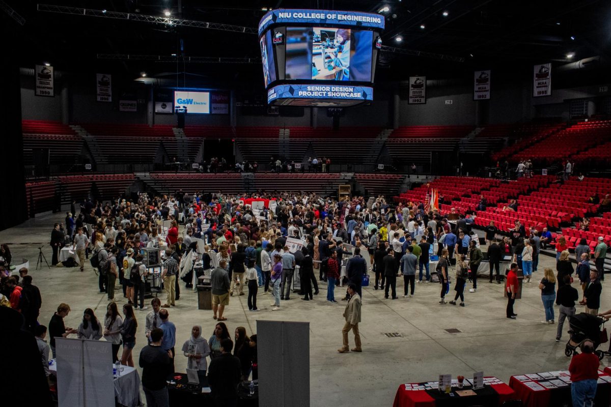 Attendees crowd the Convocation Center’s floor halfway through the senior design showcase. Over 15 high school and middle schools along with more than 283 students from schools visited the showcase Friday. (Totus Tuus Keely | Northern Star)
