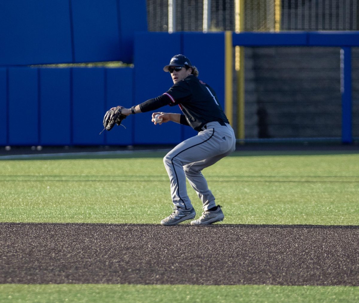 NIU senior infielder Andre Demetral gets set to throw the ball to first base on April 24 at Curtis Granderson Stadium. Demetral scored two runs as NIU baseball fell 6-5 to the University of Wisconsin-Milwaukee Panthers on Wednesday. (Northern Star File Photo)