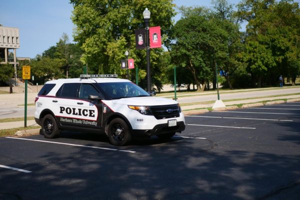 An NIU Police car sits parked on NIUs campus. Crimes such as burglary and theft were reported in April 2024 on NIUs campus. (Northern Star file photo)