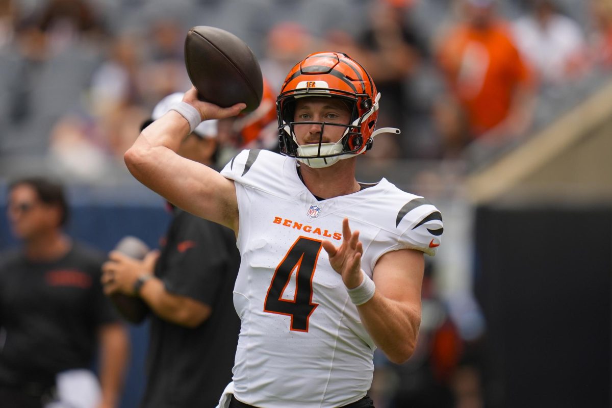 Cincinnati Bengals quarterback Rocky Lombardi (4) throws the ball before the start of an NFL preseason football game against the Chicago Bears on Aug. 17 at Soldier Field in Chicago. Lombardi was one of five former NIU Huskies who saw NFL preseason action before being released ahead of Tuesday's roster cut deadline. (Erin Hooley | AP Photo)