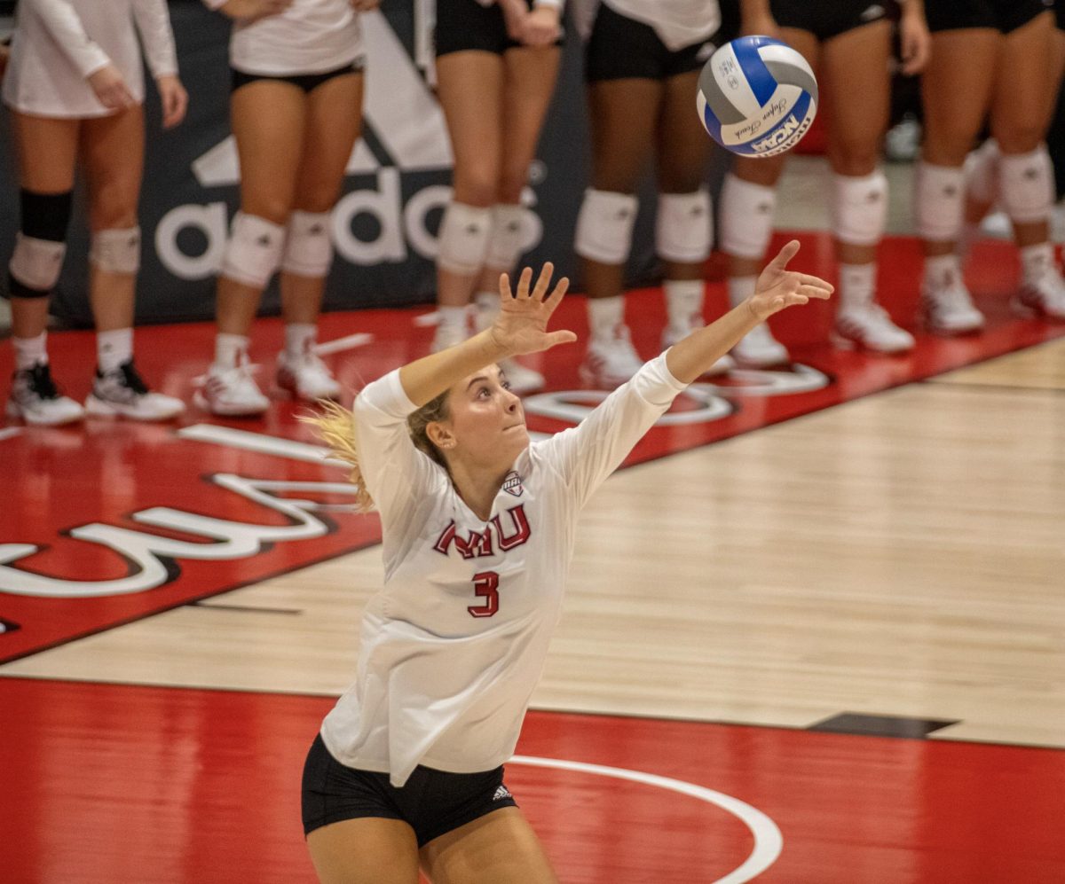 Freshman outside hitter Ava Grevengoed winds up for a serve Friday at the Convocation Center. Grevengoed recorded 5 service aces and 9 kills in a four set loss to Western Illinois University in the 2024 season opener. (Tim Dodge | Northern Star)