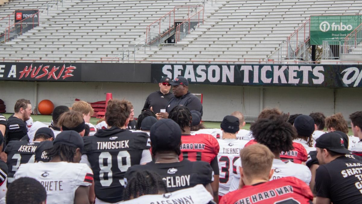 NIU head football coach Thomas Hammock speaks to his players after the Huskies’ annual spring showcase on April 27. NIU enters the 2024 season as a dark-horse contender for the Mid-American Conference championship after tying for third in the league’s preseason coaches poll. (Totus Tuus Keely | Northern Star)