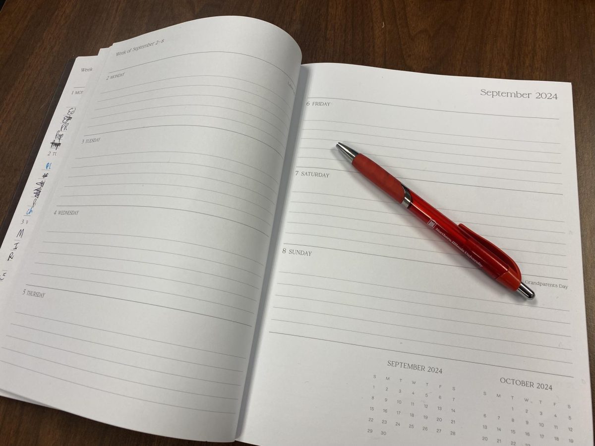 A calendar planner sits on a desk. Planning out your schedule is key to staying organized in college. (Brynn Krug | Northern Star)