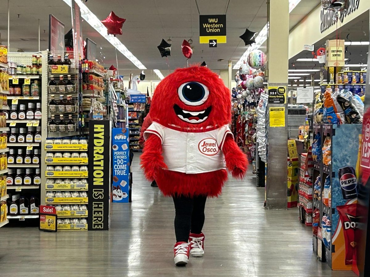 A Jewel mascot walks through the Jewel-Osco store at the Jewel Jamboree event. At the event, students received free items such as snacks and drinks. (Emily Beebe | Northern Star)