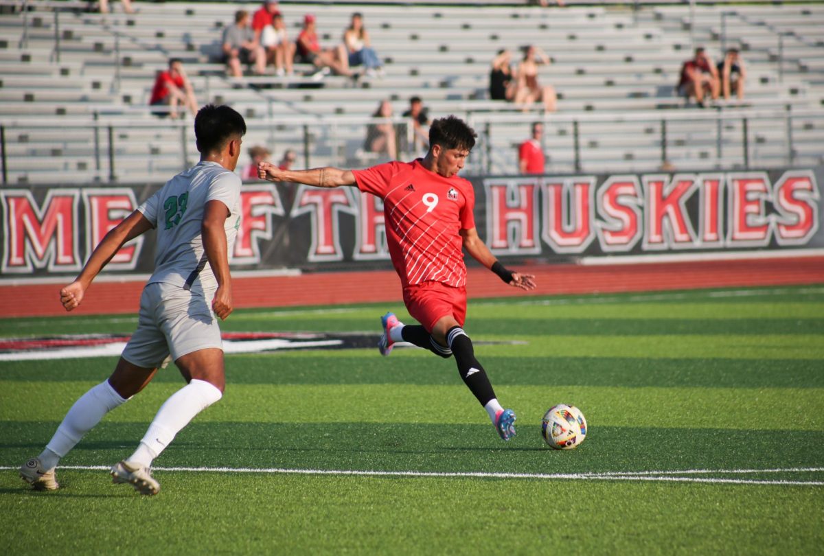 Junior forward Taylor Davis winds up a kick on Sunday at the NIU Soccer and Track & Field Complex. NIU men's soccer defeated Chicago State University 4-2 in the Huskies' 2024 home opener. (Courtesy of NIU Athletics) 