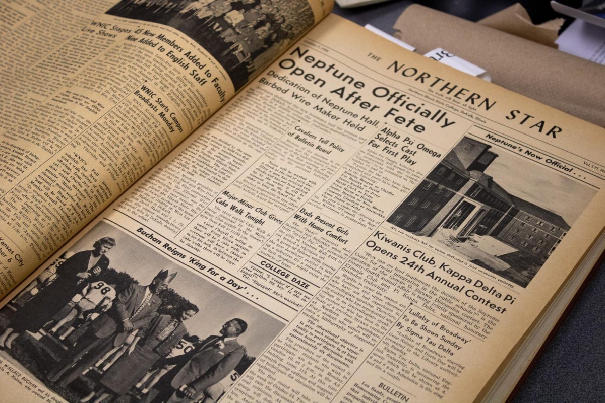 A Northern Star book from Oct. 7, 1955, sits open on a table. The Northern Star archives digitization project is delayed until the spring 2025 semester due to switching online platforms. (Ethan Rodriguez | Northern Star)