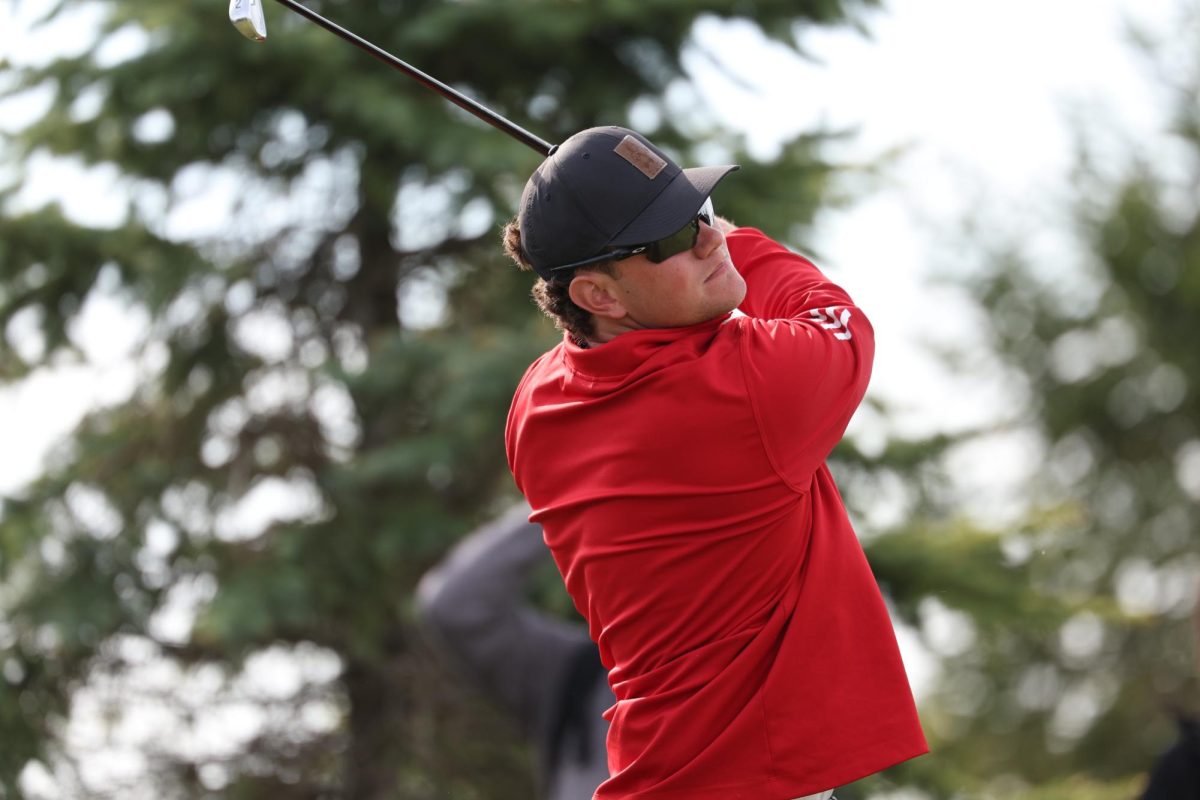 Then-junior Ben Sluzas eyes his shot during his follow-through. Sluzas, who shot a 72.12 average last season, is the top scorer returning for NIU men's golf in fall 2024. (Courtesy of NIU Athletics)