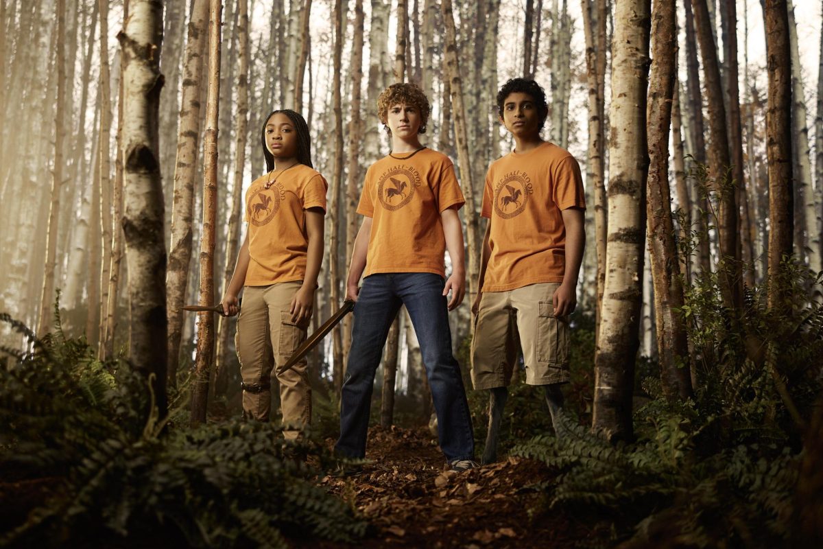 Disney's "Percy Jackson and the Olympians" cast Walker Scobell, Leah Sava Jeffries and Aryan Simhadri stand in the woods. Season 2, based off of the "Sea of Monsters" book, looks to be better than the book's film adaptation. (Disney/Matthias Clamer)